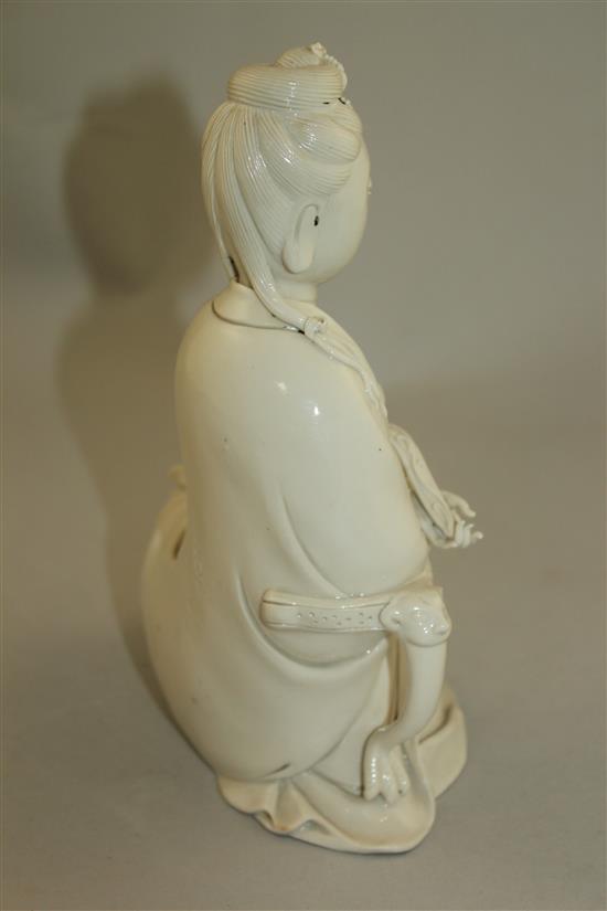 A Chinese blanc de chine seated figure of Guanyin, 20th century, 20.5cm